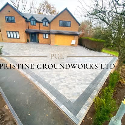 After: grey block paved driveway with a dark border outside a large detached house