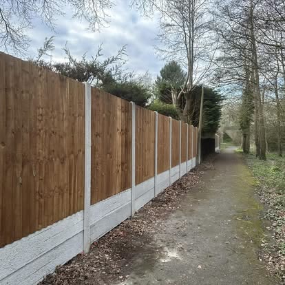 After: new closeboard fence on concrete posts along a footpath