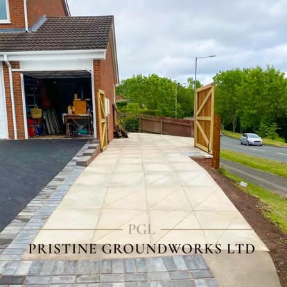 After: porcelain path with new timber fencing and gate beside a garage