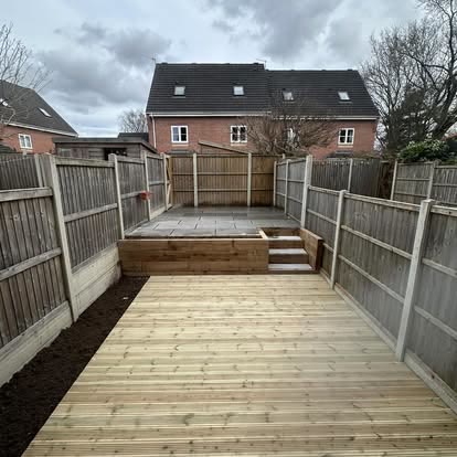 After: timber decked garden with steps and new fencing