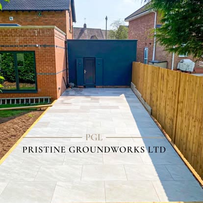 After: long porcelain patio beside new timber fencing