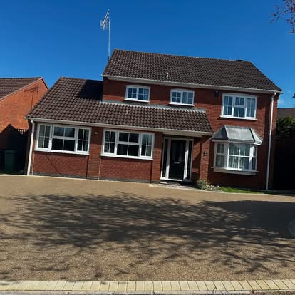 Resin bound driveway across the front of a detached house