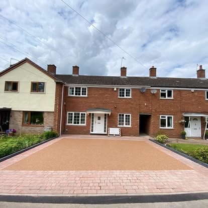 After: terracotta resin bound driveway with a red block border outside a terraced house
