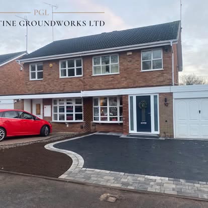 After: tarmac driveway with a contrasting block border and a red car parked outside