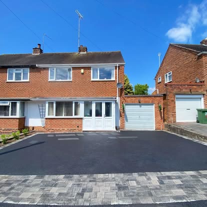 After: tarmac driveway with a grey block border in front of a semi detached house