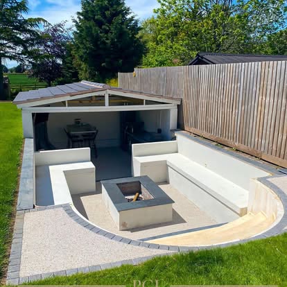 Sunken fire pit seating area with a resin surround