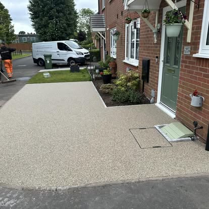 Light resin bound path leading to a front door